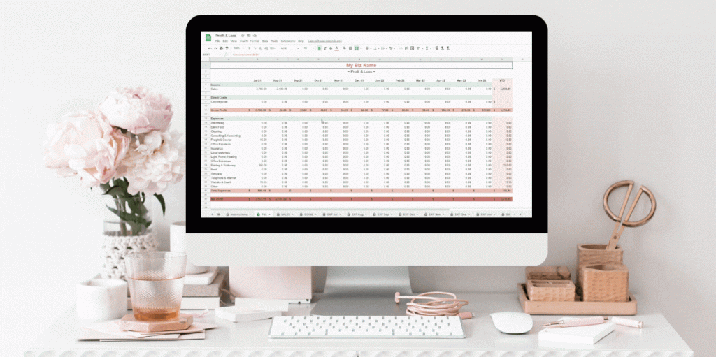 Pink and white themed desktop with mac showing few seconds video of google worksheet