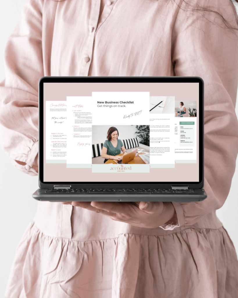 Female in pink dress holding a laptop displaying a preview of New business Checklist free dowload.