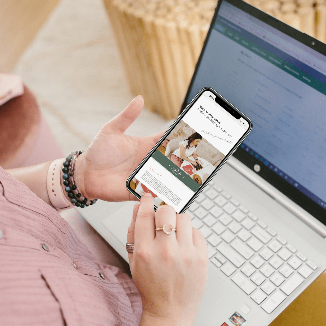 Lisa scrolling an Accounted For You Free Digital Bookkeeping Resource
